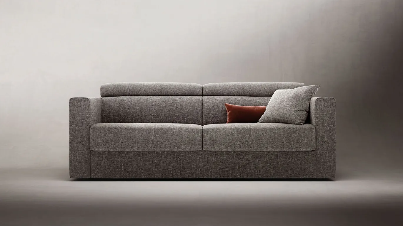 Sofa bed with adjustable headrests.